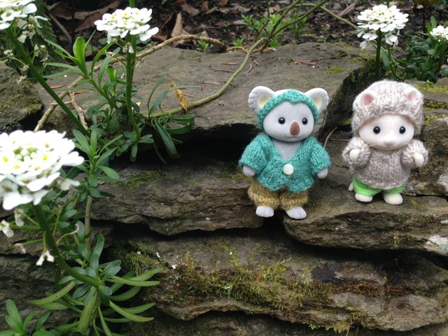<a href="http://www.ravelry.com/patterns/library/playing-in-the-woods-for-sylvanian-families-and-calico-critters">Playing in the Woods</a> miniature outfits for Calico Critters