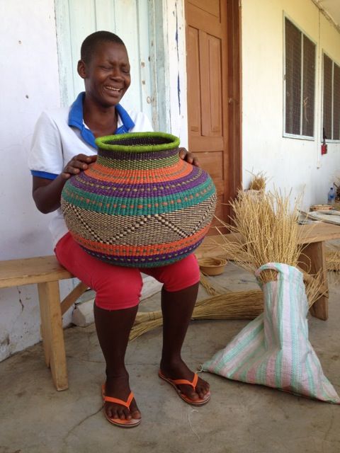 Jemima Akurigo holds a version of the basket named after her.